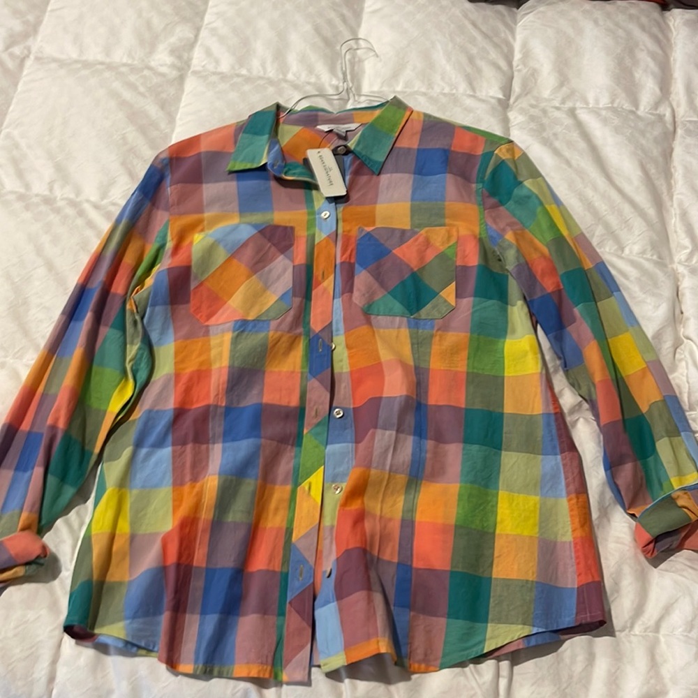 Multi color button up top with cuffed sleeve detail.